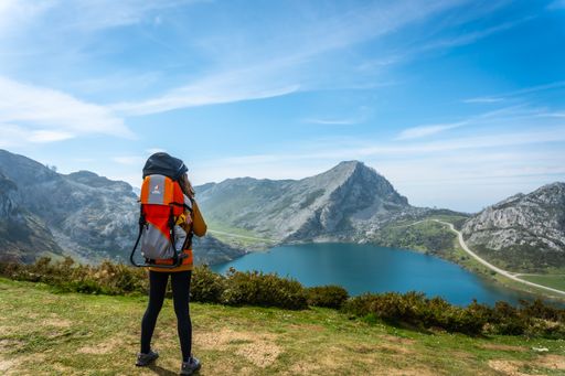 A mother with her baby looking at Lake Enol in the Lakes of Covadonga. Asturias. Spain