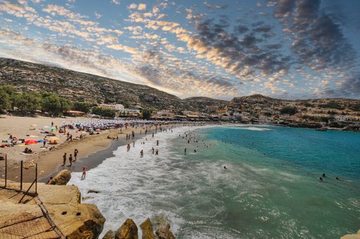Matala beach through caves on the rocks that were used as a roman cemetery, Crete island Greece