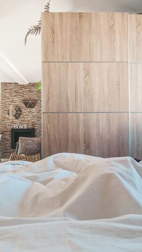 A vertical shot of a new modern bedroom