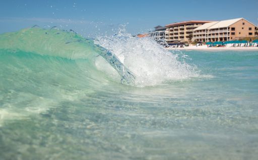 A scenic view of fresh ocean waves on the beach in Destin, Florida