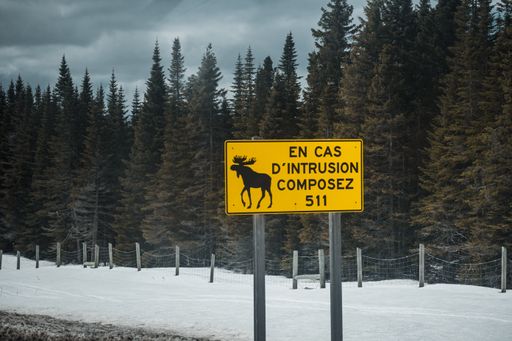 A warning road sign in french in a rural area in Ile Perrot in southwestern Quebec, Canada