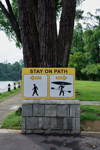 A sign in the park directing people to the walking and canoeing area