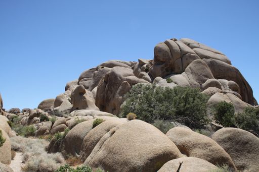 A view of big rock formations under blue bright sky