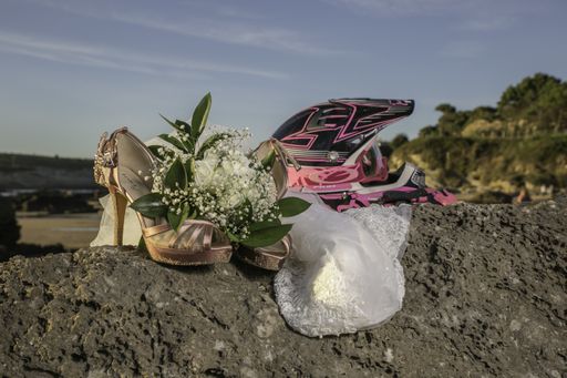 A selective focus shot of wedding bouquet, shoes and veil at outdoors - concept of wedding