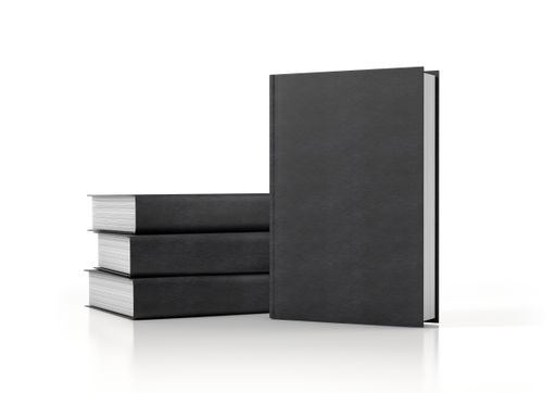 A pile of black covered books isolated on a white background