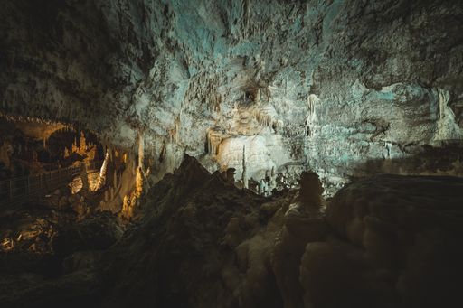 The interior of a cave with rock formations and a tunnel in Spain.Famous natural landmark