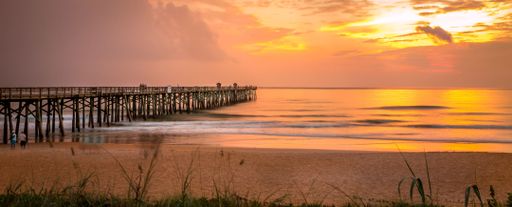 A beautiful view of Flagler Beach Fishing Pier at sunrise in Florida, USA