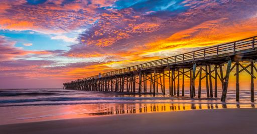 A beautiful view of Flagler Beach Fishing Pier at sunrise in Florida, USA