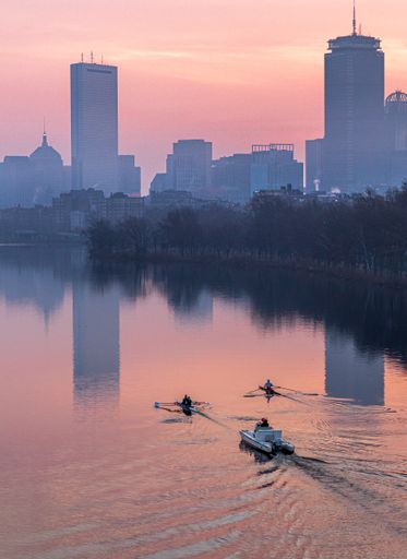 A vertical shot of a beautiful river during sunrise in Boston, USA