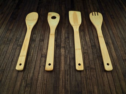 selection of kitchen tools made out of wood, spoon, fork and spatulas