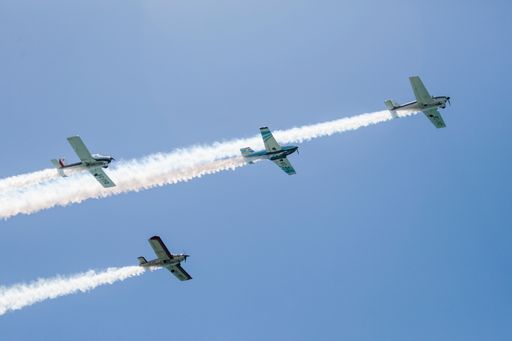 A low angle shot of an aircraft display in a blue sky over Malaga, Spain