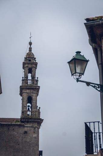 A vertical shot of a church tower in Santiago de Compostela, Spain