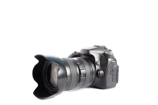 A closeup of a camera on a white surface