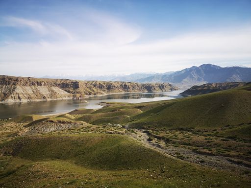 A scenic view of a valley with a water reserve in Afghanistan