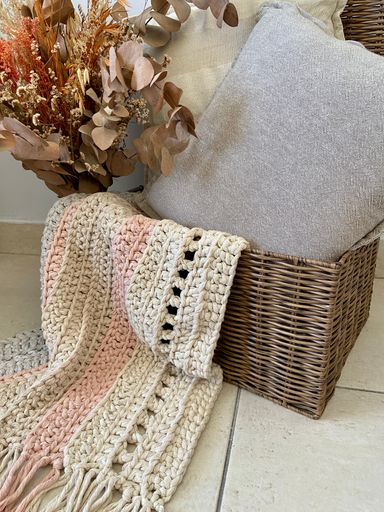 A closeup of hand woven rug with multi-strand cotton thread