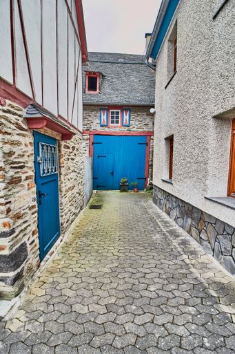 A beautiful shot of a stone floor street with old houses in the old village Monreal buildings, Germany