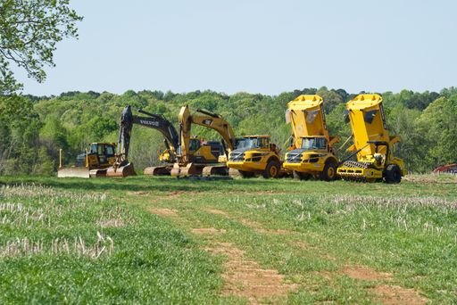 A heavy equipment truck lined up in the field