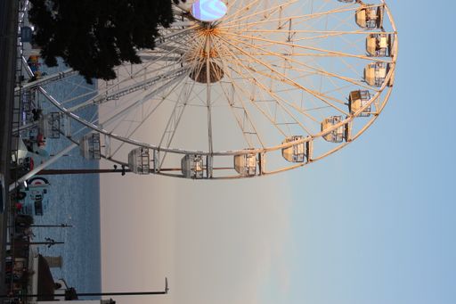 A vertical shot of Ferris wheel attraction in Bournemouth during sunset