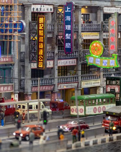 A vertical shot of a toy design of a busy street with buildings in and cars in Hong Kong
