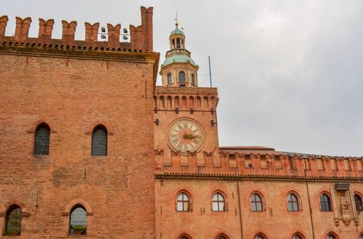 A beautiful shot of the Palazzo Comunale (City Hall) against cloudy sky during daytime, Piazza Maggiore, Bologna, Emilia Romagna, Italy
