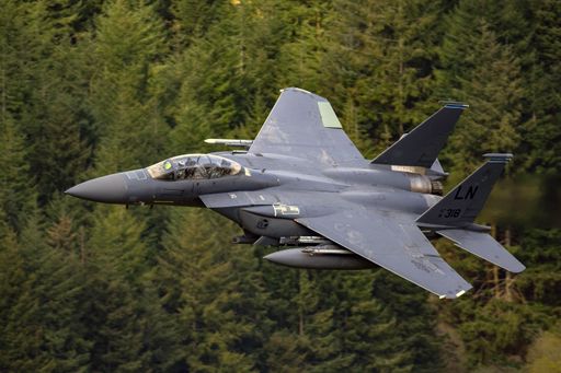 An aerial shot of a USAF F15E training in the Mach Loop, North Wales, UK