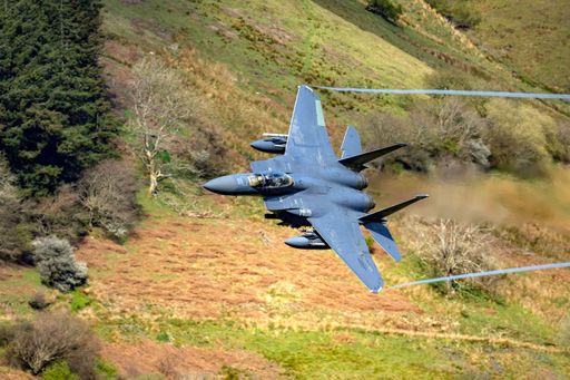 An aerial shot of a USAF F15E jet training in the Mach Loop, North Wales, UK