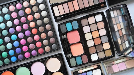 A closeup shot of colorful and different size eyeshadow palettes