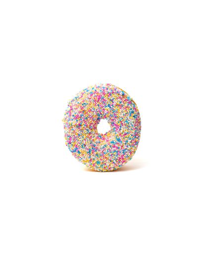 A creamy vanilla donut with colorful sprinkles isolated on a white background