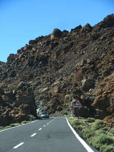A vertical shot of a road on mountains