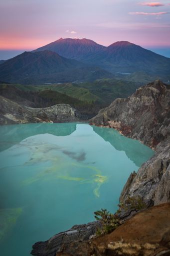 A beautiful view of Ijen Volcano complex in Indonesia under red sunset sky