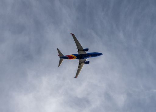 The Southwest Airlines plane flying in the sky. Everett, Washington, United States.