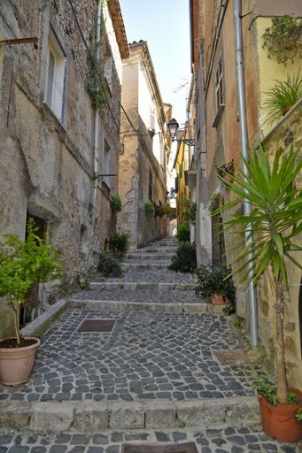 A narrow street among the old houses of Giuliano di Roma, a village in the Lazio region of Italy