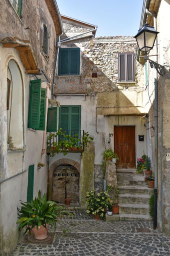 A narrow street among the old houses of Giuliano di Roma, a village in the Lazio region of Italy