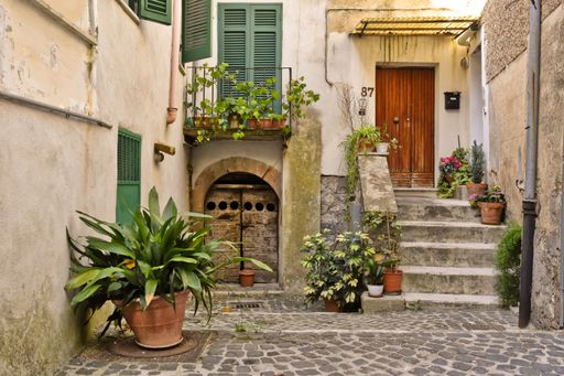 A narrow street among the old houses of Amaseno, a medieval village in the Lazio region of Italy