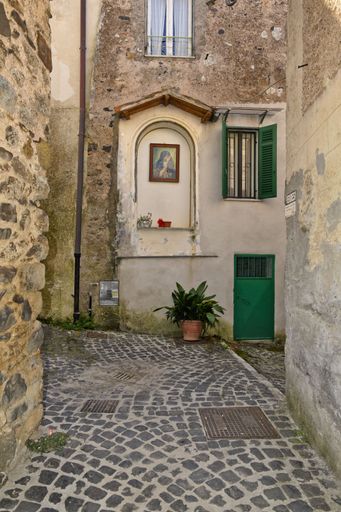 A narrow street among the old houses of Giuliano di Roma, a village in the Lazio region of Italy