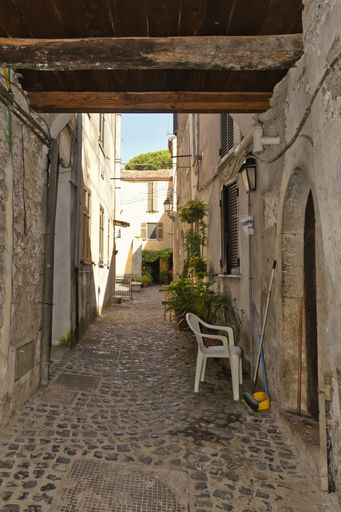 A narrow street among the old houses of Giuliano di Roma, a village in the Lazio region of Italy