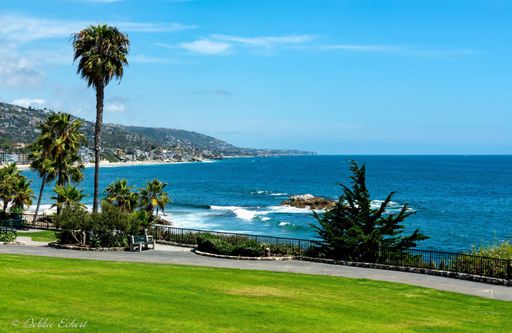 View of the Pacific Ocean and city views, taken from above, in Laguna Beach, California.