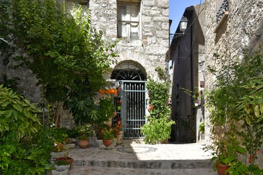 A narrow street among the old houses of Lenola, a medieval village in the Lazio region, Italy.