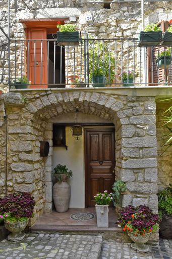 A vertical shot of an old building entrance in Lenola. Province of Latina, Lazio, Italy.