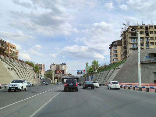 A closeup shot of cars driving in the traffic at the exit of Davtashen bridge