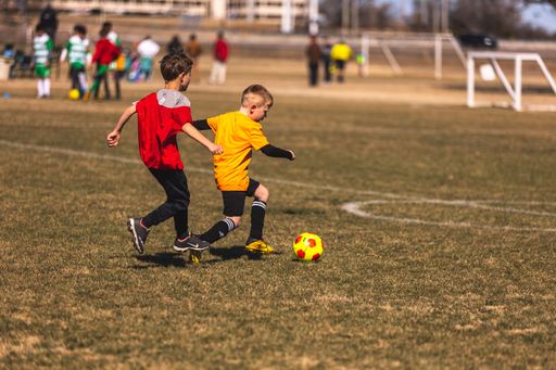 Young soccer players playing on a field in Fort Worth, United States