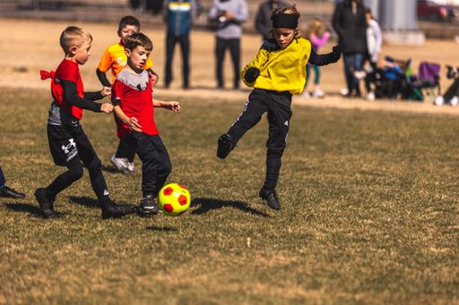 Young soccer players playing on a field in Fort Worth, United States