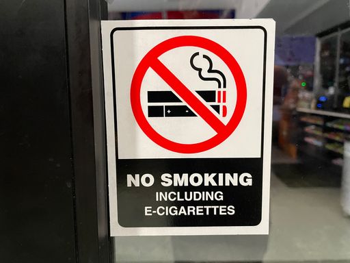 Augusta, Ga USA - 04 27 22: No smoking sign on a glass door
