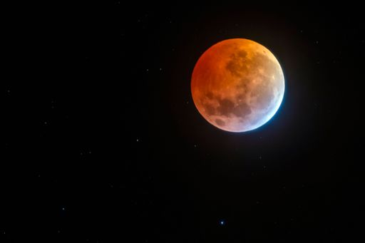 A mesmerizing view of a moon in the dark black sky at night
