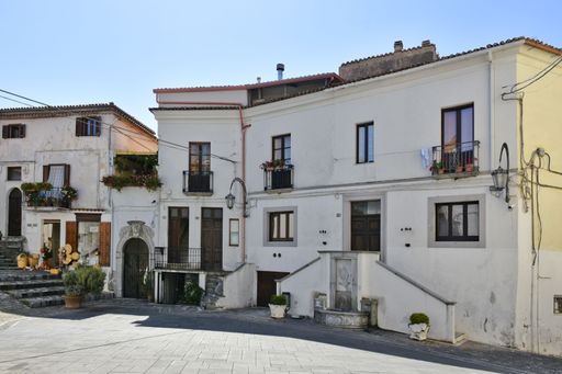 A scenic view of a square against old houses in Aieta village, the Calabria region, Italy