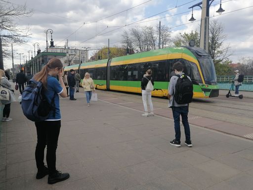 A passengers waiting on a public transport tram stop in the Most Teatralny bridge in Poznan, Poland
