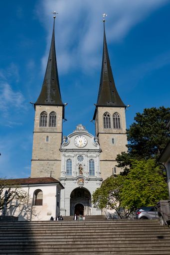 A vertical shot of an exterior of the Church of St. Leodegar in Lucerne, Switzerland