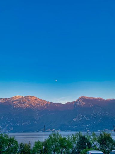 A vertical shot of a beautiful lake near the mountains in summer