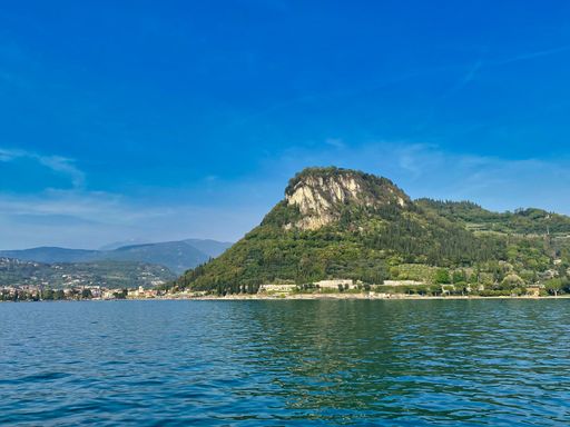 An aerial view of a beautiful lake near the mountains in summer