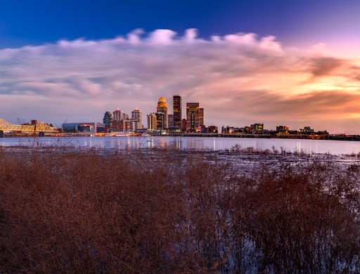 A beautiful scene of a cityscape with long exposure of buildings by the water in Louisville, Kentucky, USA